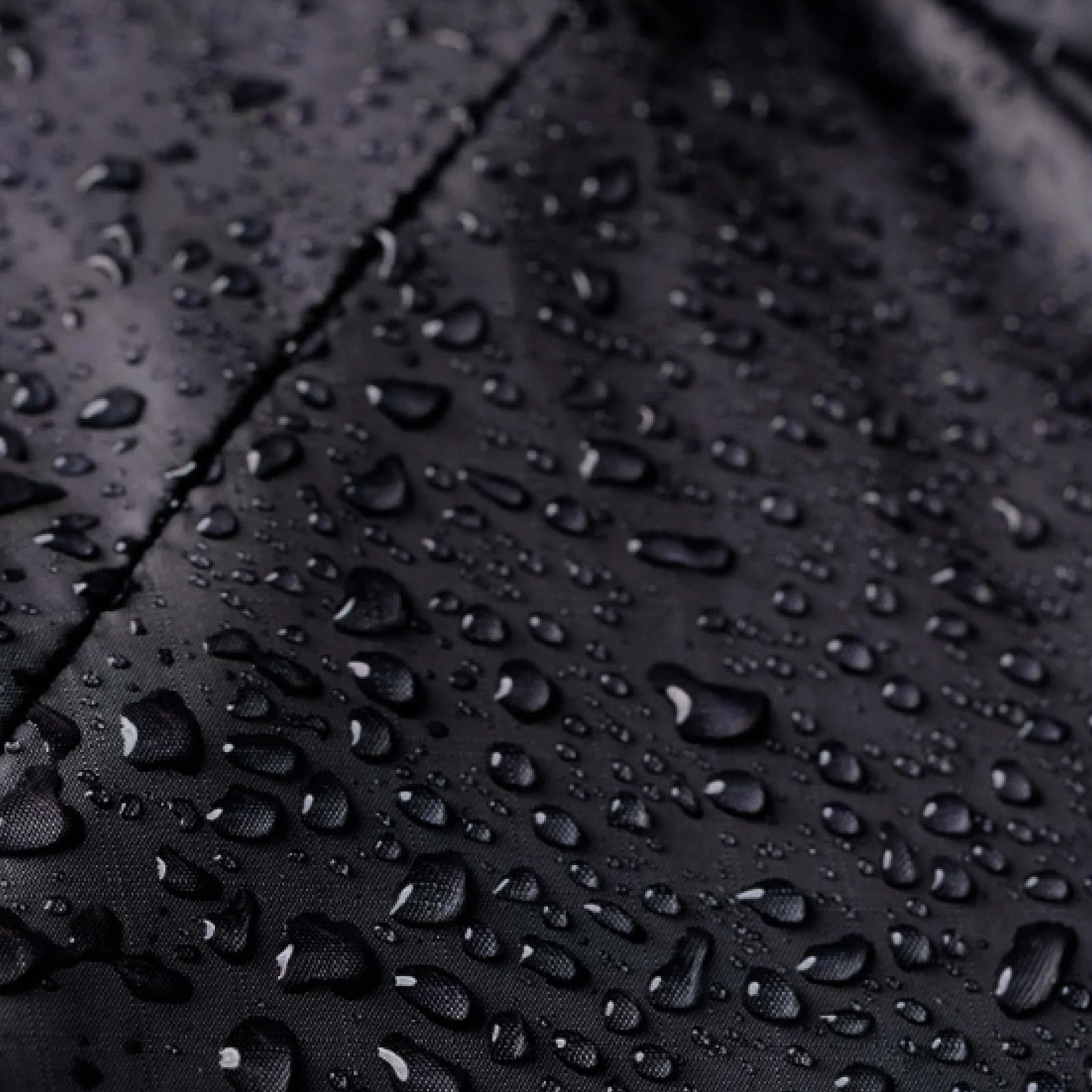 Water droplets beading on Houdini spinner material.