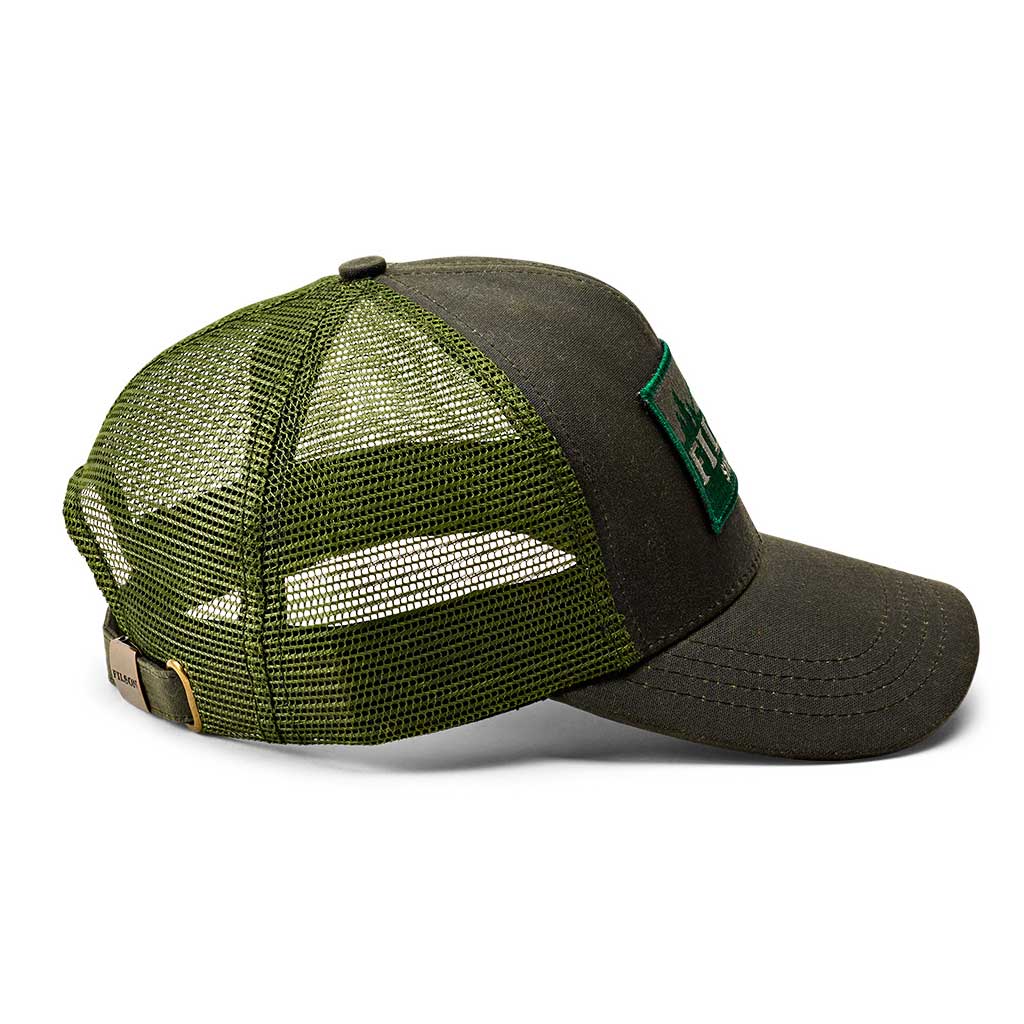A green Filson mesh logger cap with an adjustable strap and a brass buckle, featuring the Filson logo on the front.