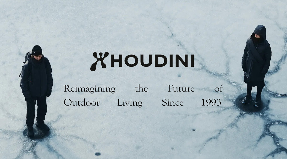 Houdini brand banner with two figures in black outdoor gear standing on snow and ice