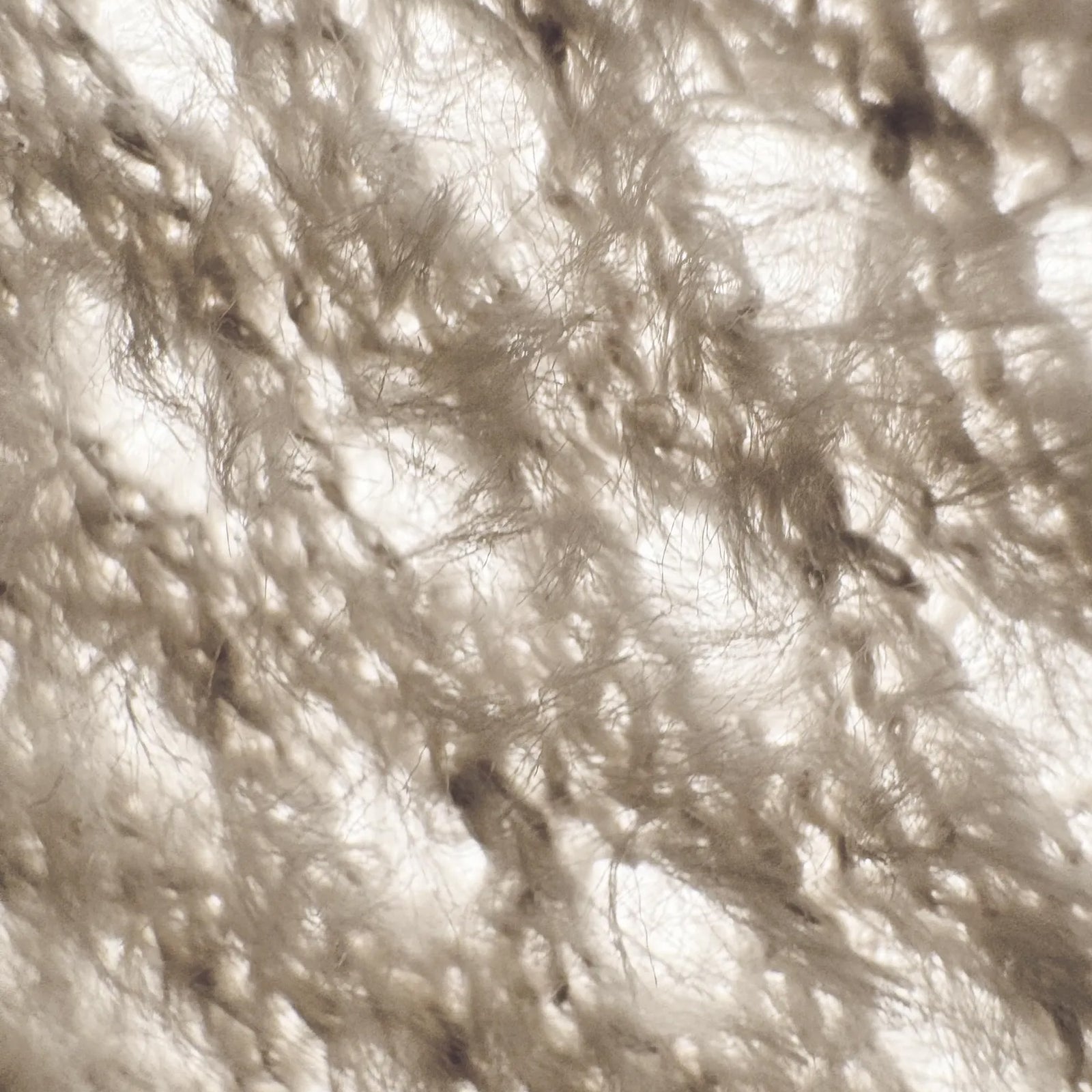 Houdini Airweb material close-up showing lightweight woven fabric texture.